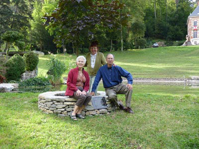 2010 – The Canadian maple tree, planted in 2008 to commemorate the Tour de France, thrives in the front yard at Château de Molinière. L. to R. Lucille Mollot, Arlette Auclerc and Vic Mollot